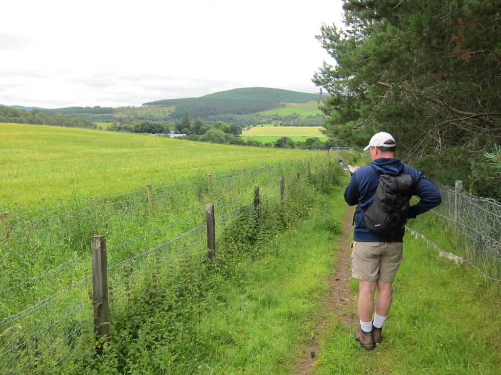 Gavan studies the guidebook as we pass through the Mains of Dalvey farm.