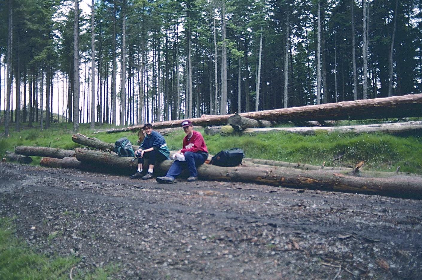 Elizabeth and Gavan have a rest on a forestry road above Glendalough