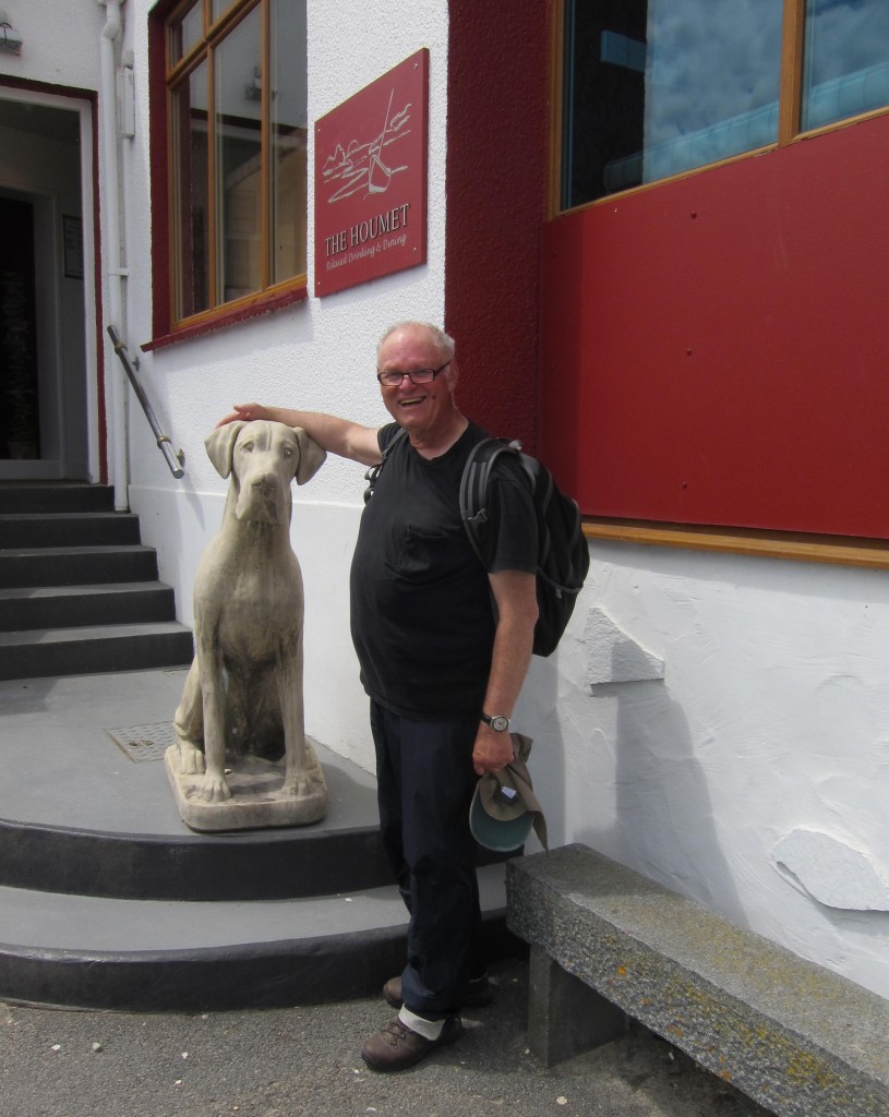 I pose with marble dog at the Houmet Tavern.