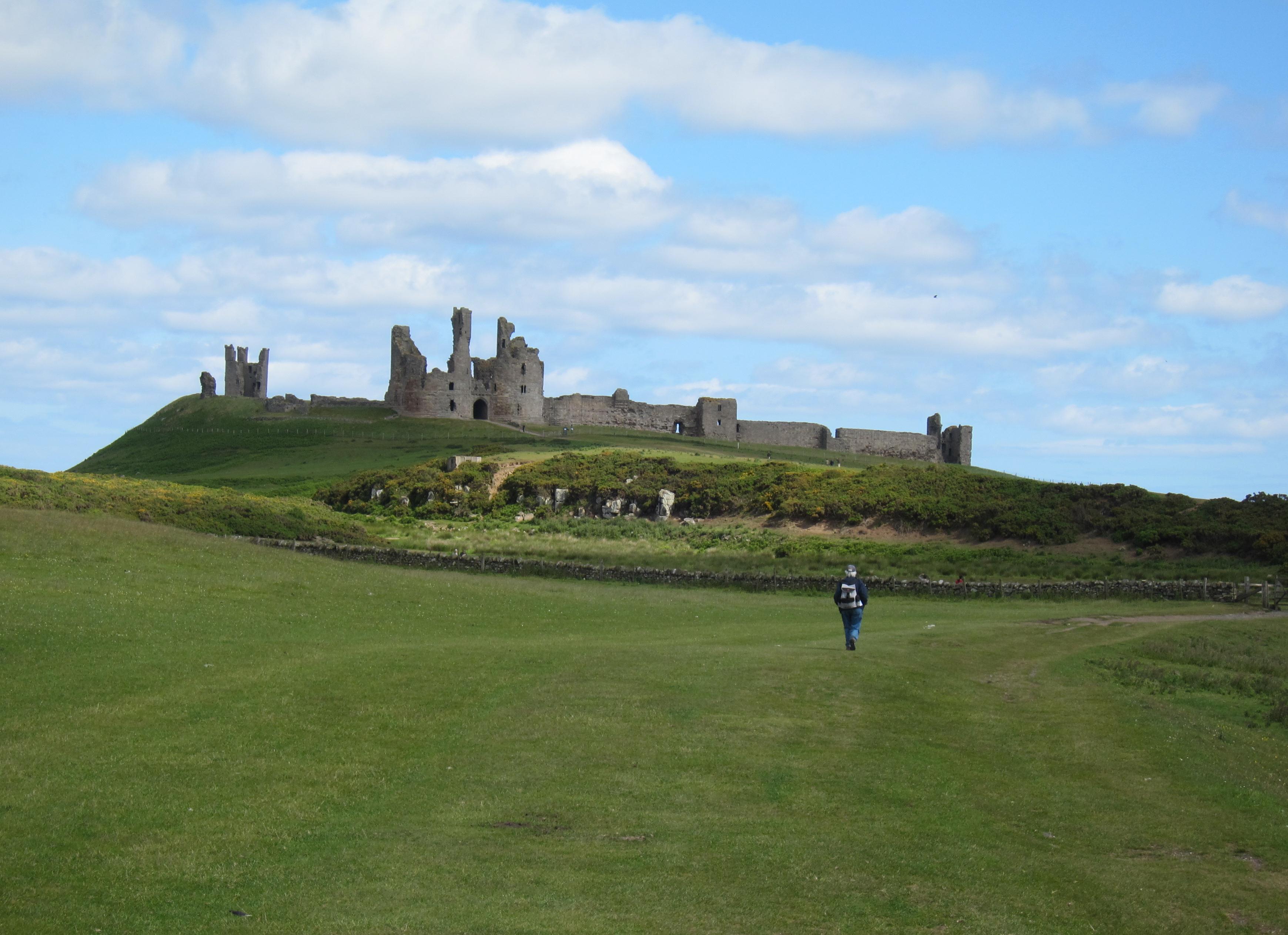 Tosh approaches Dunstanburgh Castle