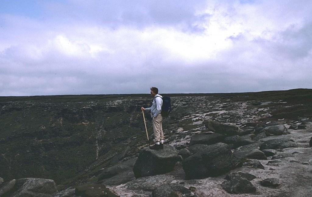 I stand on a rock near the Kinder Downfall