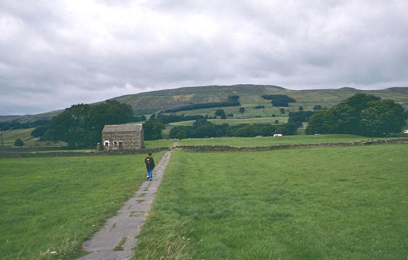 Dorothy on the flagstone path near the Haylands Bridge  – as we begin another expedition on the Pennine Way