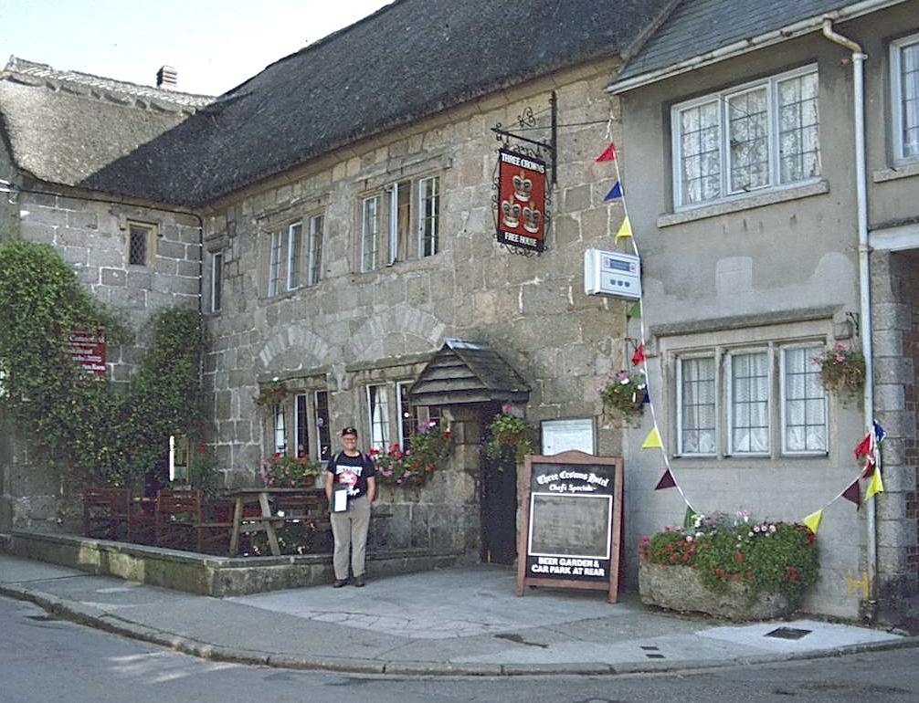 I stand in front of the Three Crowns, Chagford.