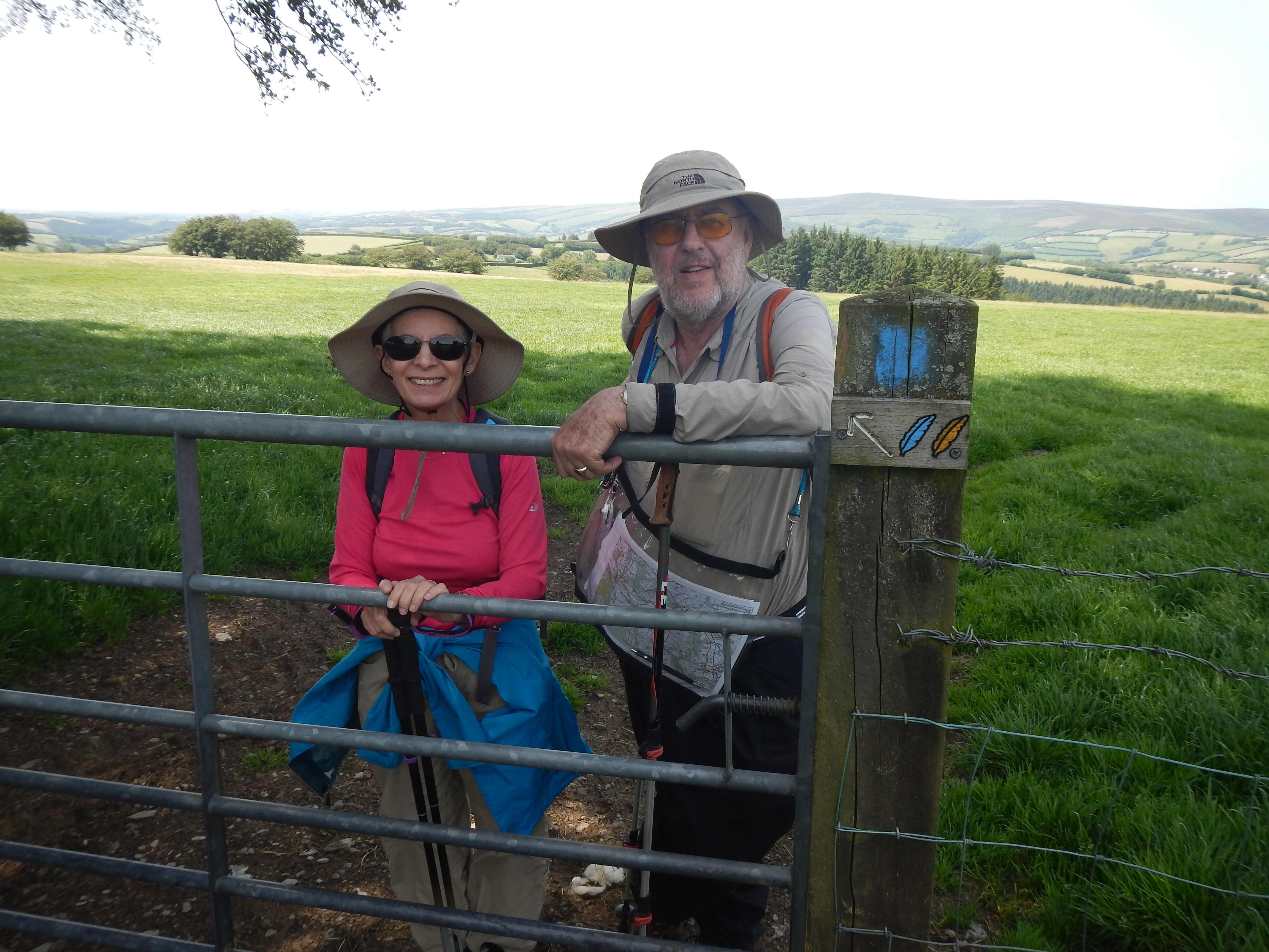 Naomi and Adrian shelter from the sun before we head downhill to Wheddon Cross