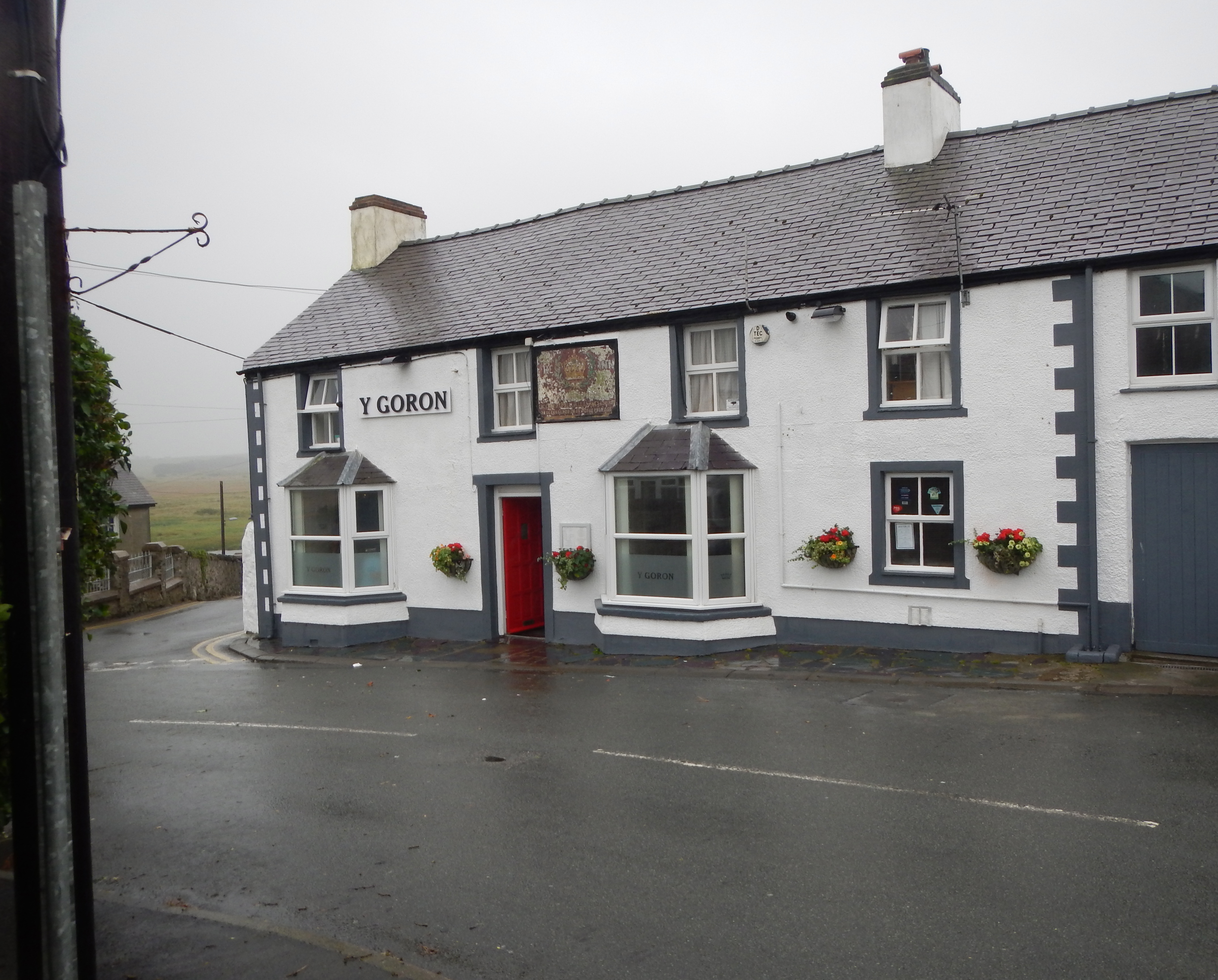 After two miles of rain-lashed road walking I reach the comforts of Aberffraw’s pub, Y Goron (The Crown).