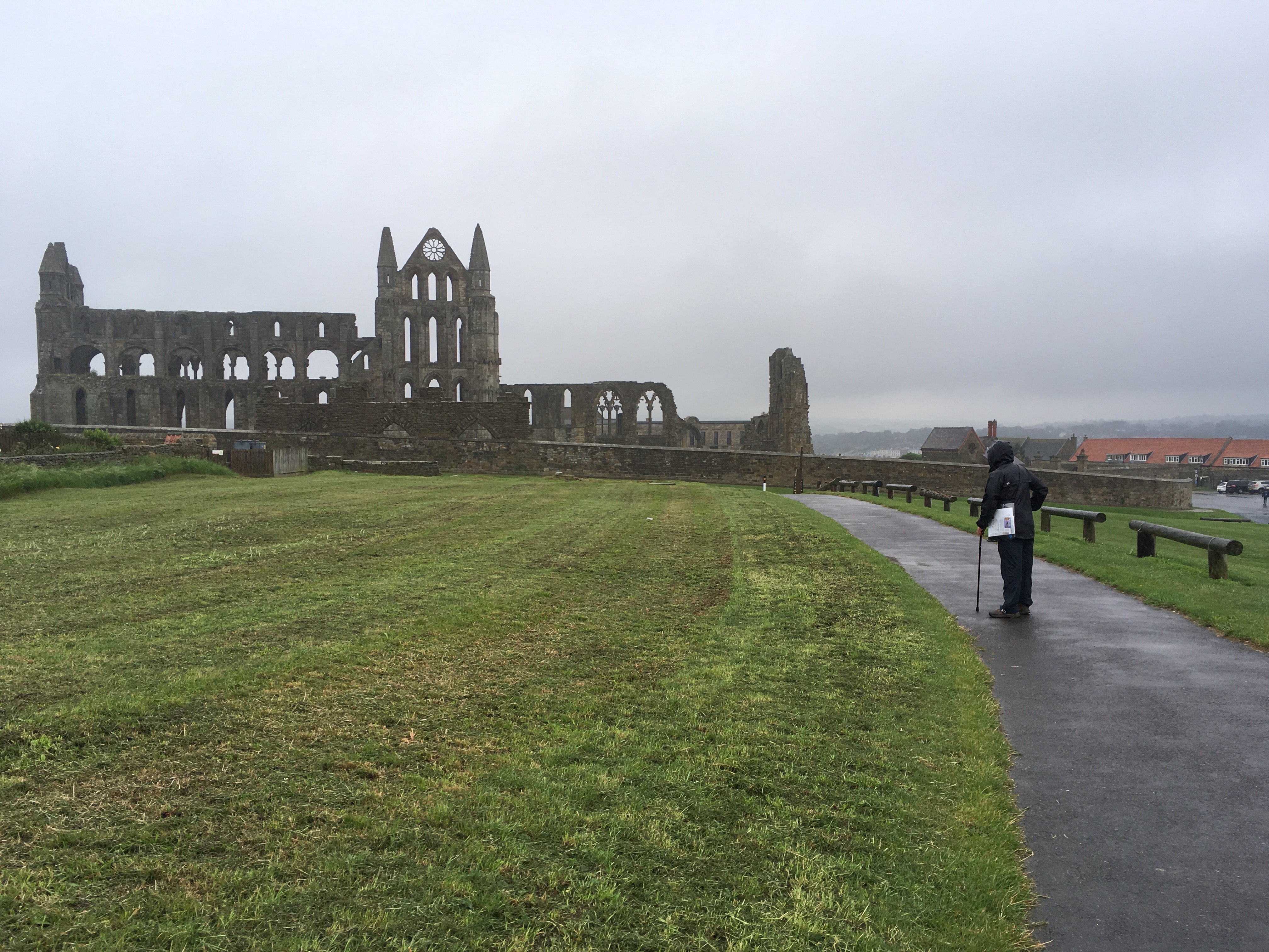 In the rain I contemplate the ruins of Whitby Abbey.